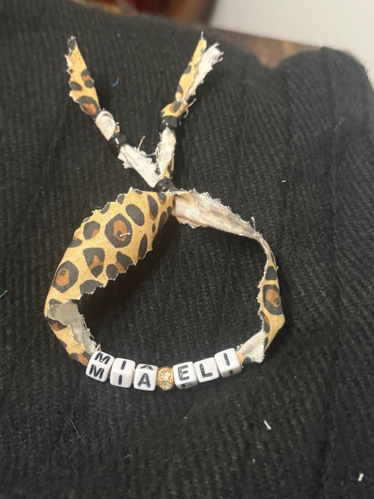 Leopard print fabric bracelet with MIA and ELI letter beads